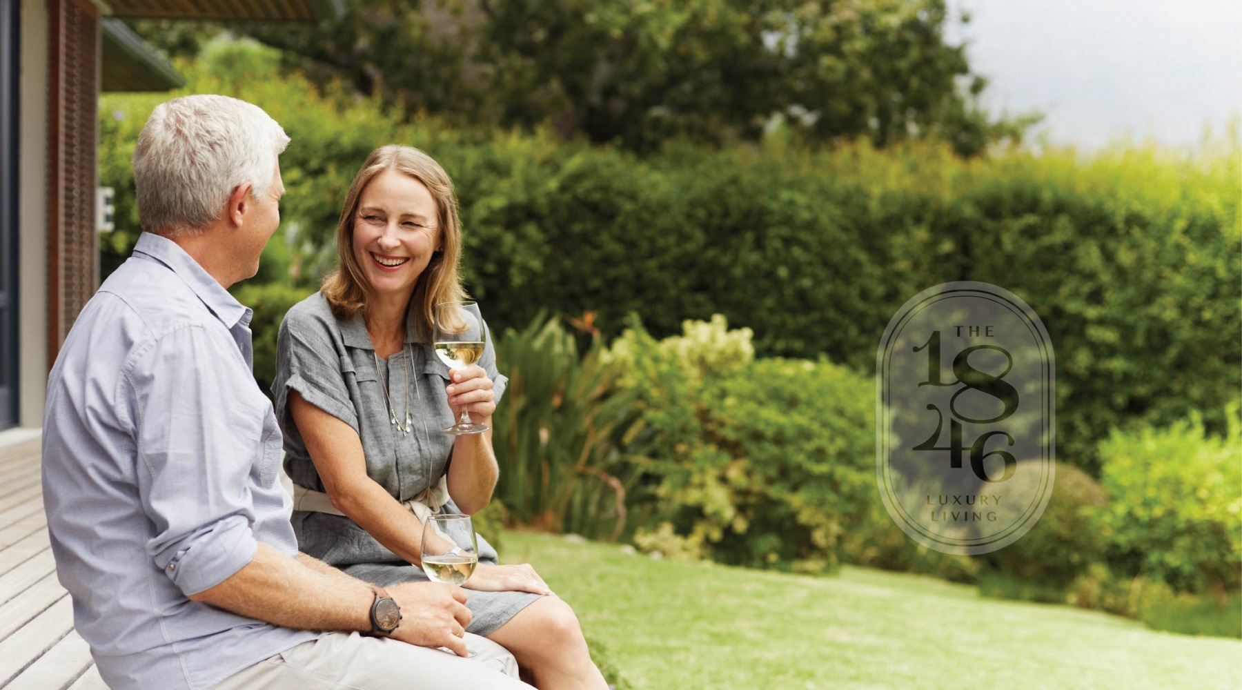 middle age couple sitting while talking and drinking wine middle age couple sitting while talking and drinking wine